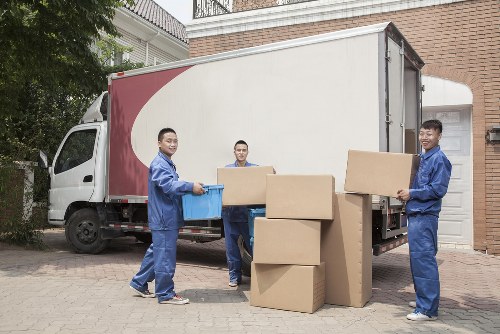 Removal team preparing a Watford house move with boxes and furniture