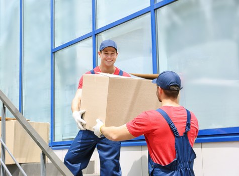 Local team handling furniture pick-up in a Watford residential area