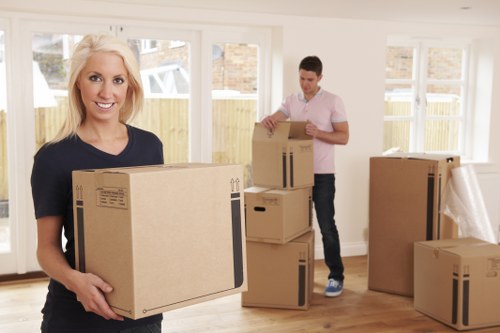 Mover carrying furniture safely during a house move