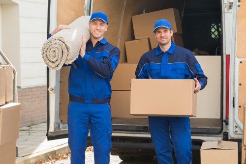 Flat removals team loading furniture for a Watford apartment move