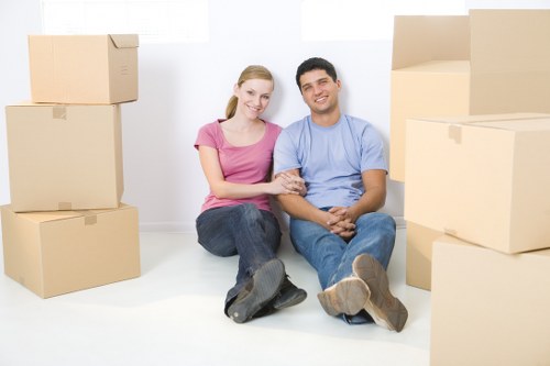 Removals team preparing items safely for transport in Watford