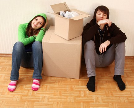 Staff assessing risks before lifting furniture during a removal