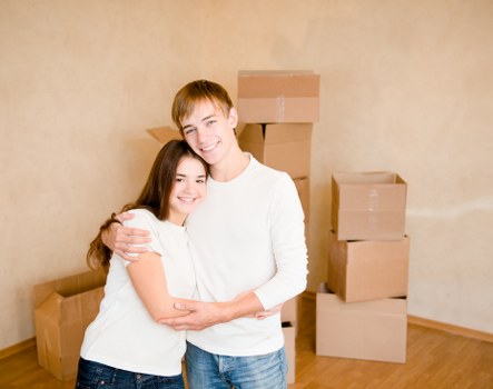Office furniture and boxes prepared for a Watford business move