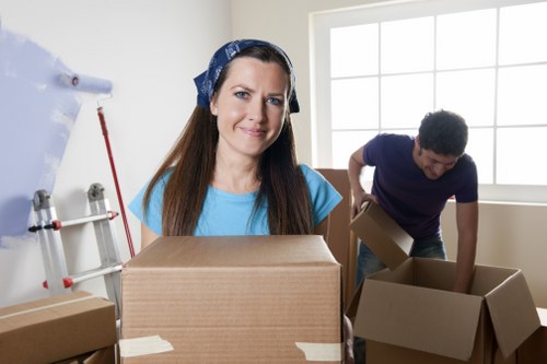 Packed boxes and moving team preparing a Watford relocation