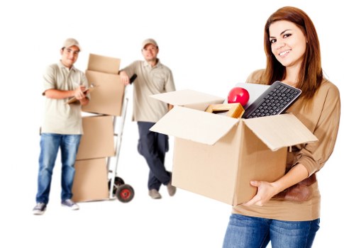 Loading furniture and boxes into a removal truck in Watford