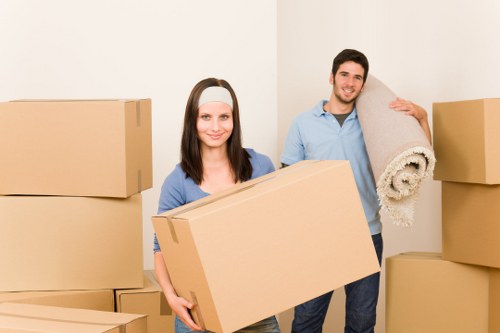 Loading furniture into a van for a home move in Watford