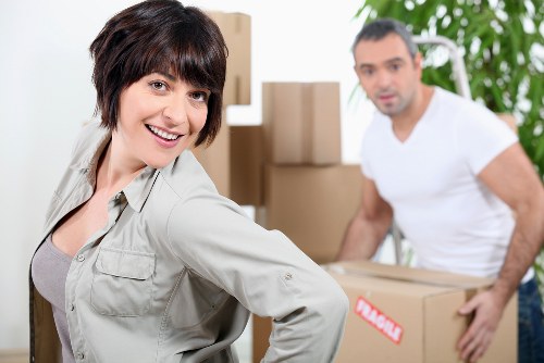 Local moving team unpacking household items in Watford