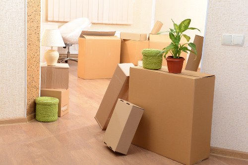 Boxes and furniture prepared for a student move into storage